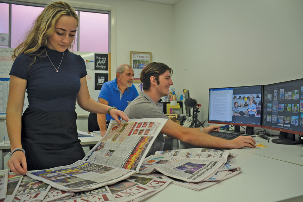 The Express Newspaper cadet journalist Ellie Fink, managing director Carl Portella and journalist Rhys Thomas in the editorial room prior to print