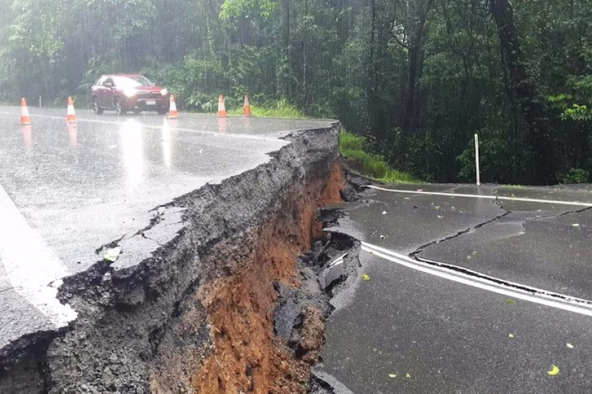 Massive damage to the Palmerston Highway is expected to take months to repair.
