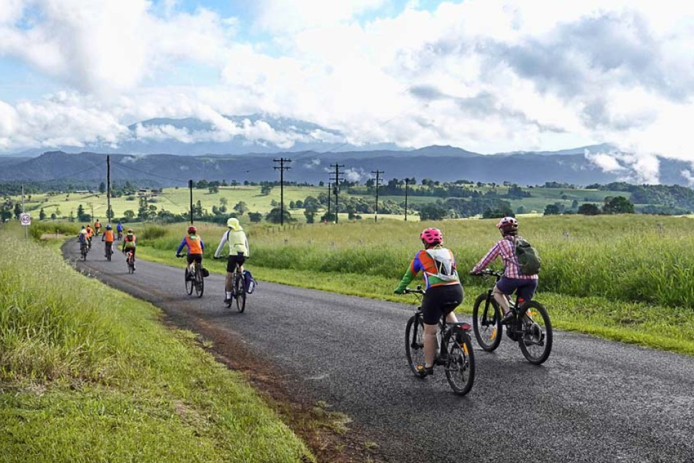 Around 40 members of the Tablelands Sixty and Over Cycling group rode out to Millaa Millaa to give businesses support during the highway closure. BELOW: Cyclists stopped into Rumours Café to give the business a financial boost.