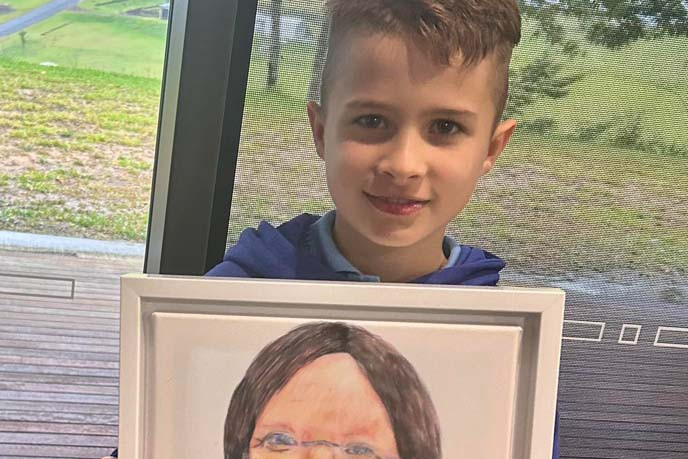 A Malanda boy has gone above and beyond in his artistic talents, being the youngest in his age category to receive a Highly Commended in the Brisbane Portrait Prize.