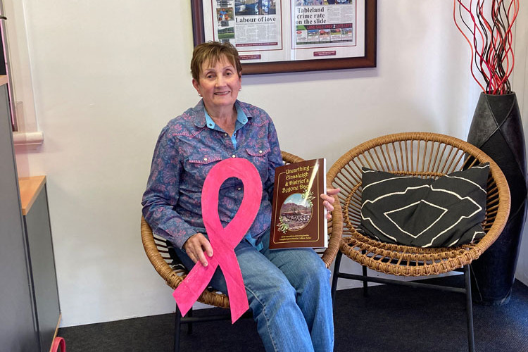 Breast cancer survivor Colleen Taylor invites everyone to the Pink Ribbon morning tea. Below is the pink whip that will be auctioned at the event.