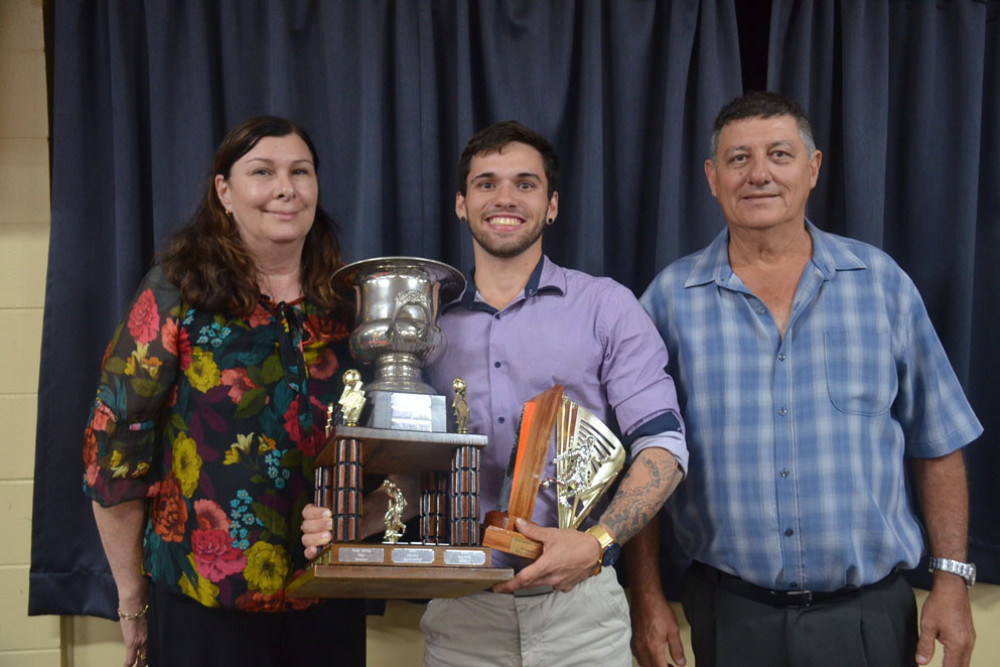 Senior player of the Year Dylan Cummings with trophy sponsor Lucy Conner from Mareeba Leagues Club and club President Mario Ghensi.