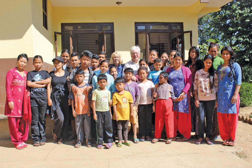Doctor Digby and Anne Hoyal with families at the Silom Children’s House in Nepal.