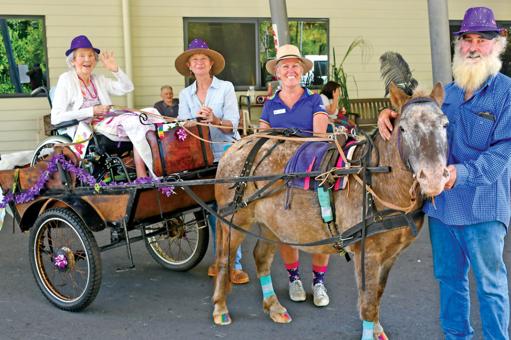 (from left) Carinya resident Jean Smith is pictured taking a ride, with Janine Bergin, Leesa Hart, and Ian Beck with Tony the Pony.