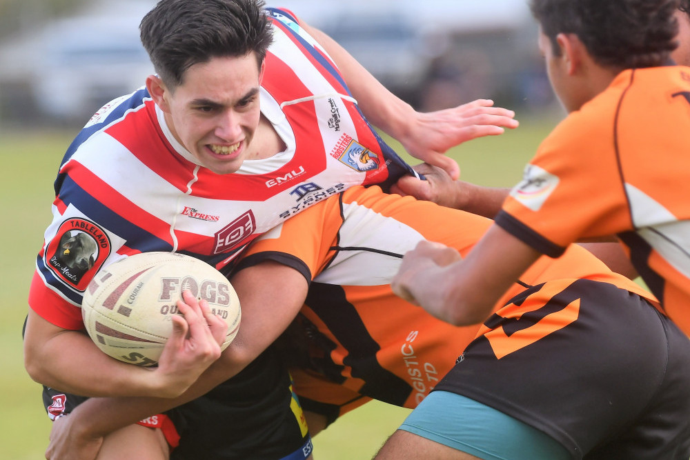 Roosters under 18 centre Keyarn Porter looks to make metres against Tully on Saturday