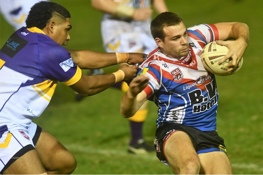 Roosters Glenn Dumbrell looks to escape the Edmonton defence on Saturday night.