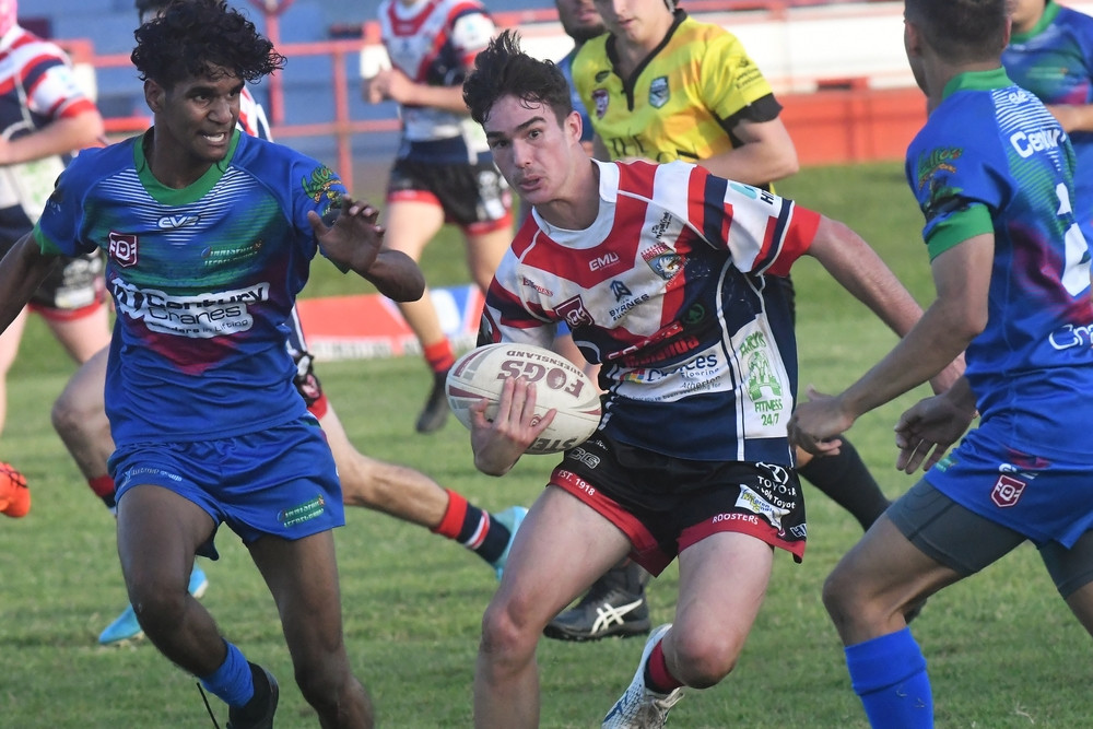 Roosters Tait Coghlan in traffic against Innisfail on Saturday.