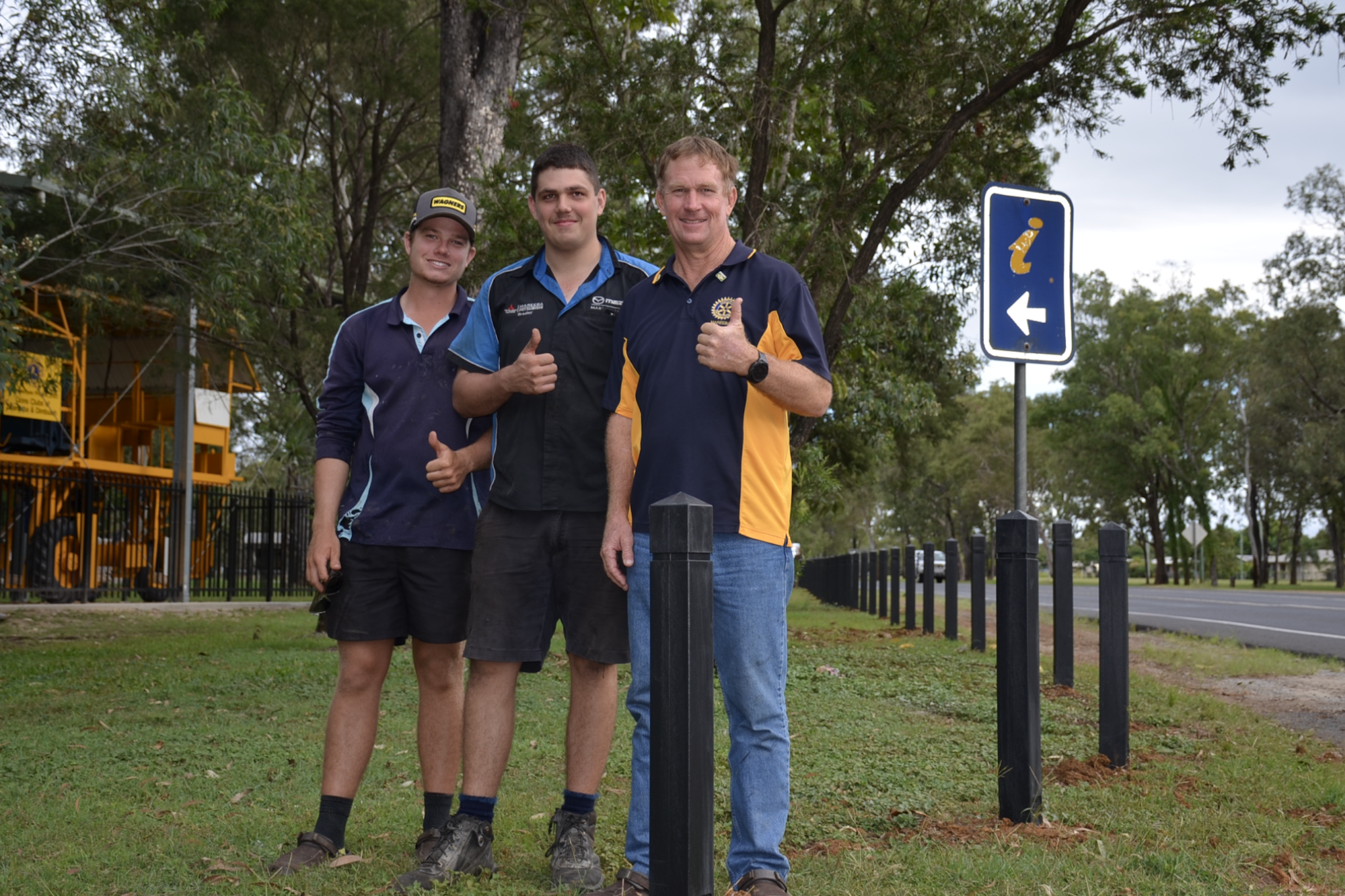 PICTURED: Rotarian Kevin Davies with sons Liam and Bradley in front of new recycled bollards installed at Ant Hill Park in front of the Mareeba Heritage Centre.