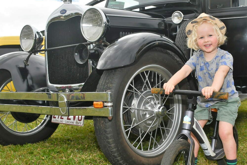 Malanda youngster Jack Hawkins checks out the vintage cars at last year's show