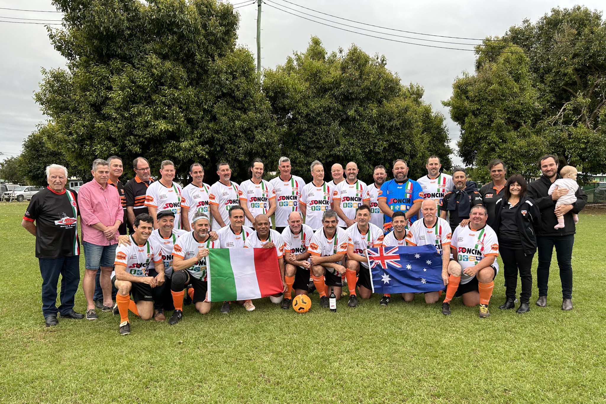 Mareeba’s over 45s team with John Bomben (left) and members of the Moriconi family (right).