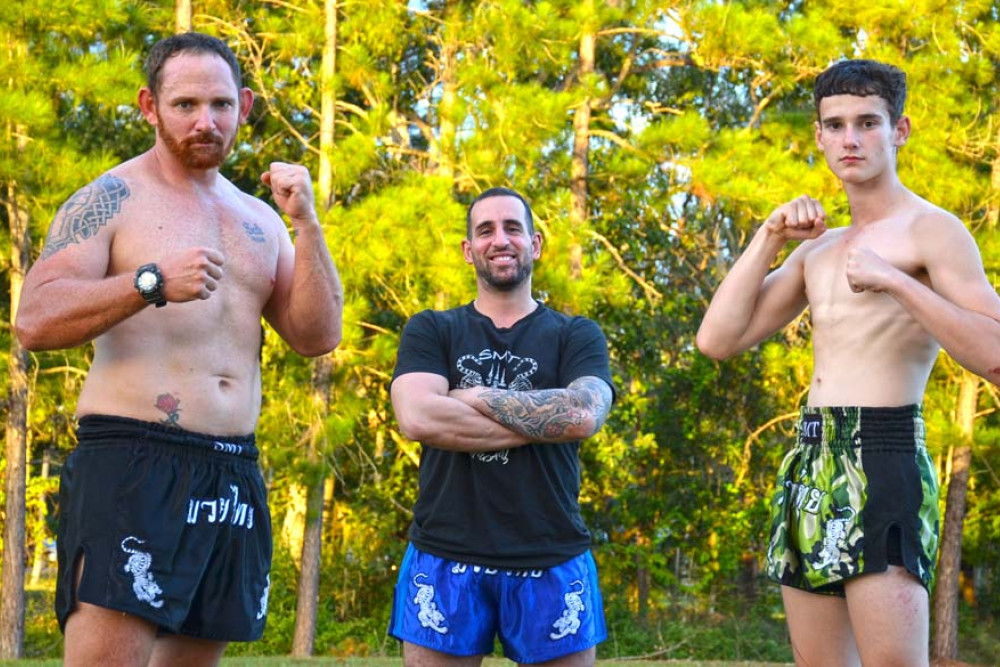 Bryan Wyborn and Jye Whibberley with coach Rosario Signorino, ready to face off in the “biggest fight Cairns has seen” next week. Absent: Chris Obodin.