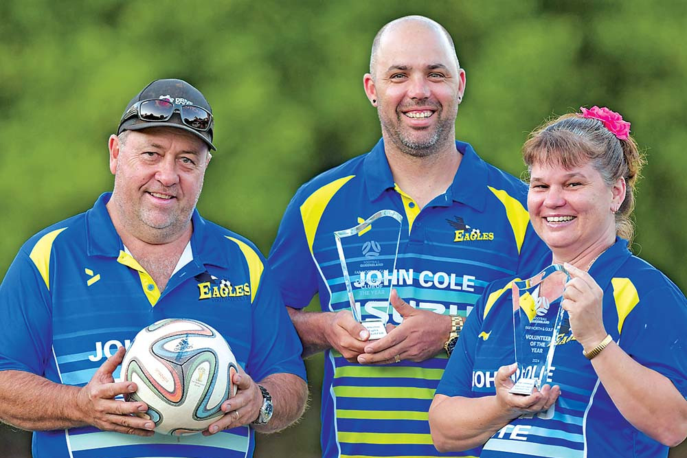 Club president Jason Cummings (left), club vice-president Jimmy Pearsall with the Community Club of the Year Award and Kim Cummings with her Volunteer of the Year Award.