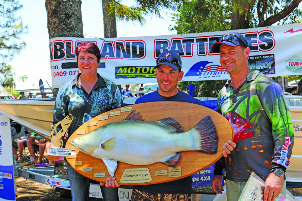 This year's 30th Barra Bash is coming to Tinaroo, with fishermen from across the region gearing up and ready to go. Pictrured is Ann Leighton, Liam Casella-Champion Angler 2019 (22 Barramundi measuring 13.67metres) and Scott Heinemann of Bills Marine.