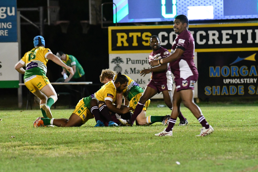 Leon Wood and Ryan Flegler tackle Yarrabah on Friday night.