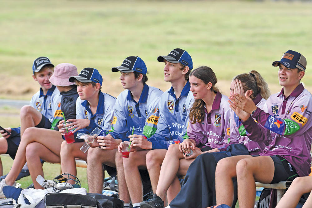 friendly rivalry: Students from St Stephen’s Catholic College and Mareeba High School sat together to support their team mates on the field during the Dr Mark Bestmann memorial cup.