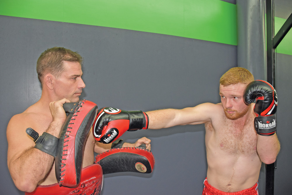 Black Dog Muay Thai owner and head trainer Daniel Grant practising with fighter Michael Quintieri for their upcoming fight on Saturday