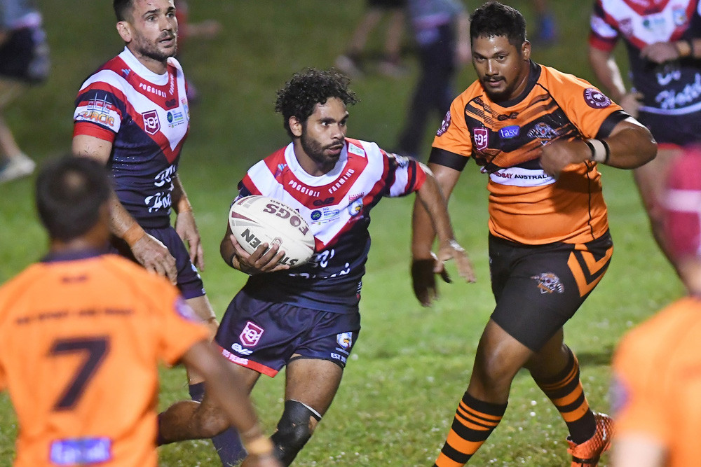 Roosters fullback Ty Grogan eyes the try line against Tully on Saturday night