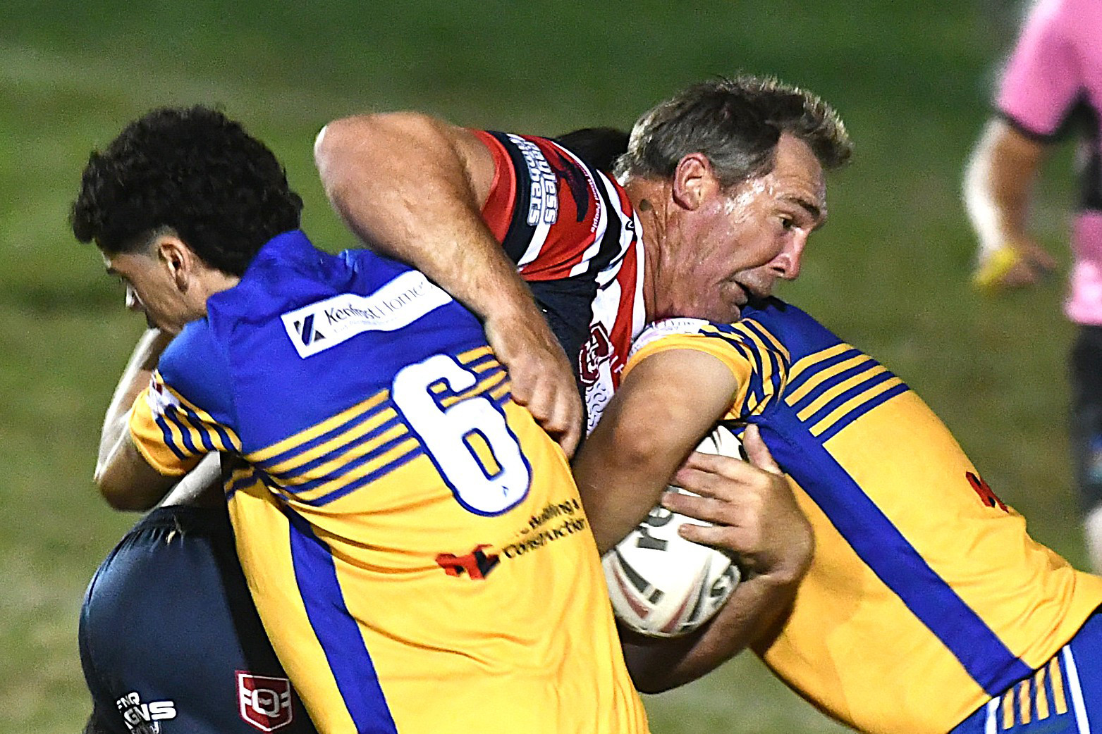 Roosters’ Scott Bolton, who scored a try in Saturday’s match, takes a tackle.