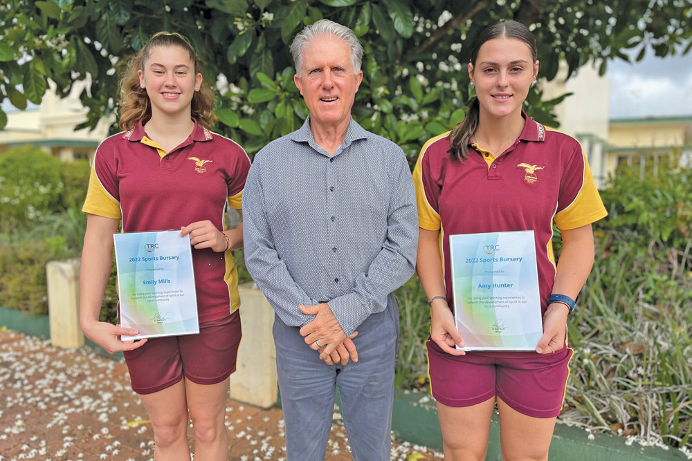 Tablelands Regional Council 2022 Sports Bursary recipients Emily Mills and Amy Hunter with mayor Rod Marti after receiving their bursaries.