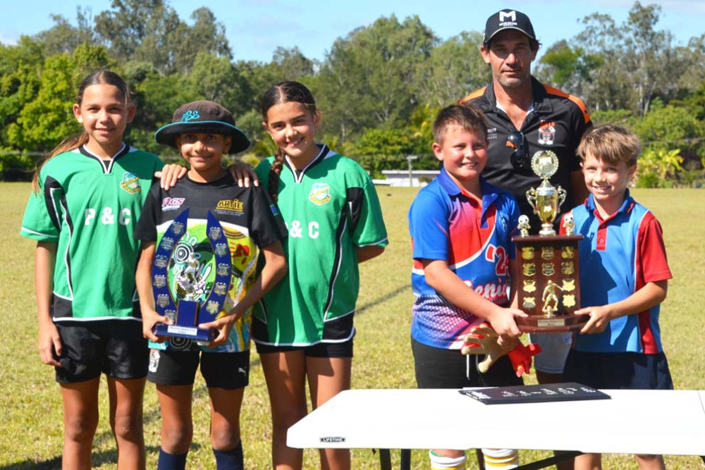 Wayne Shroj with the winning schools and their trophies.
