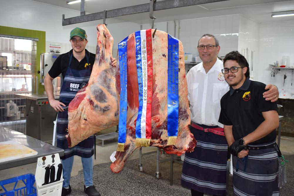 Mark and Tootie Nucifora with the champion carcass and apprentice butcher Riley Collins.