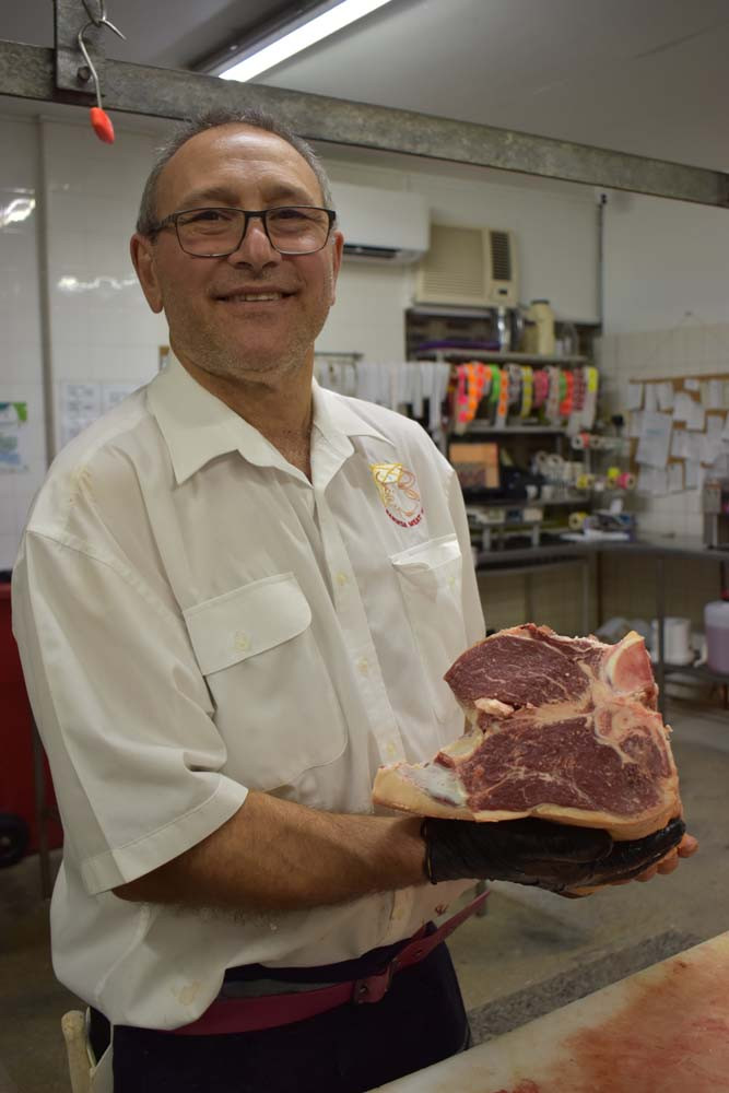 Tootie Nucifora holding T-Bone from the champion carcase.