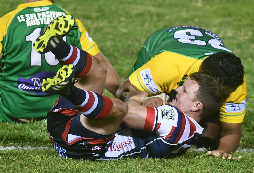 Roosters Brendon Power claimed by the Gladiators defence.