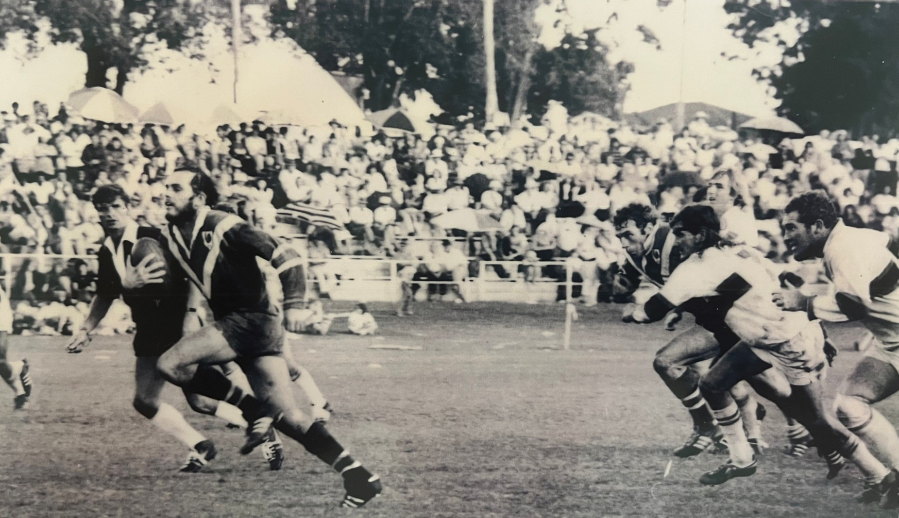 Atherton Roosters player Jeff Moss makes a break in the 1975 Eacham Rugby League Grand Final that saw the Roosters defeat the Mossman Sharks.