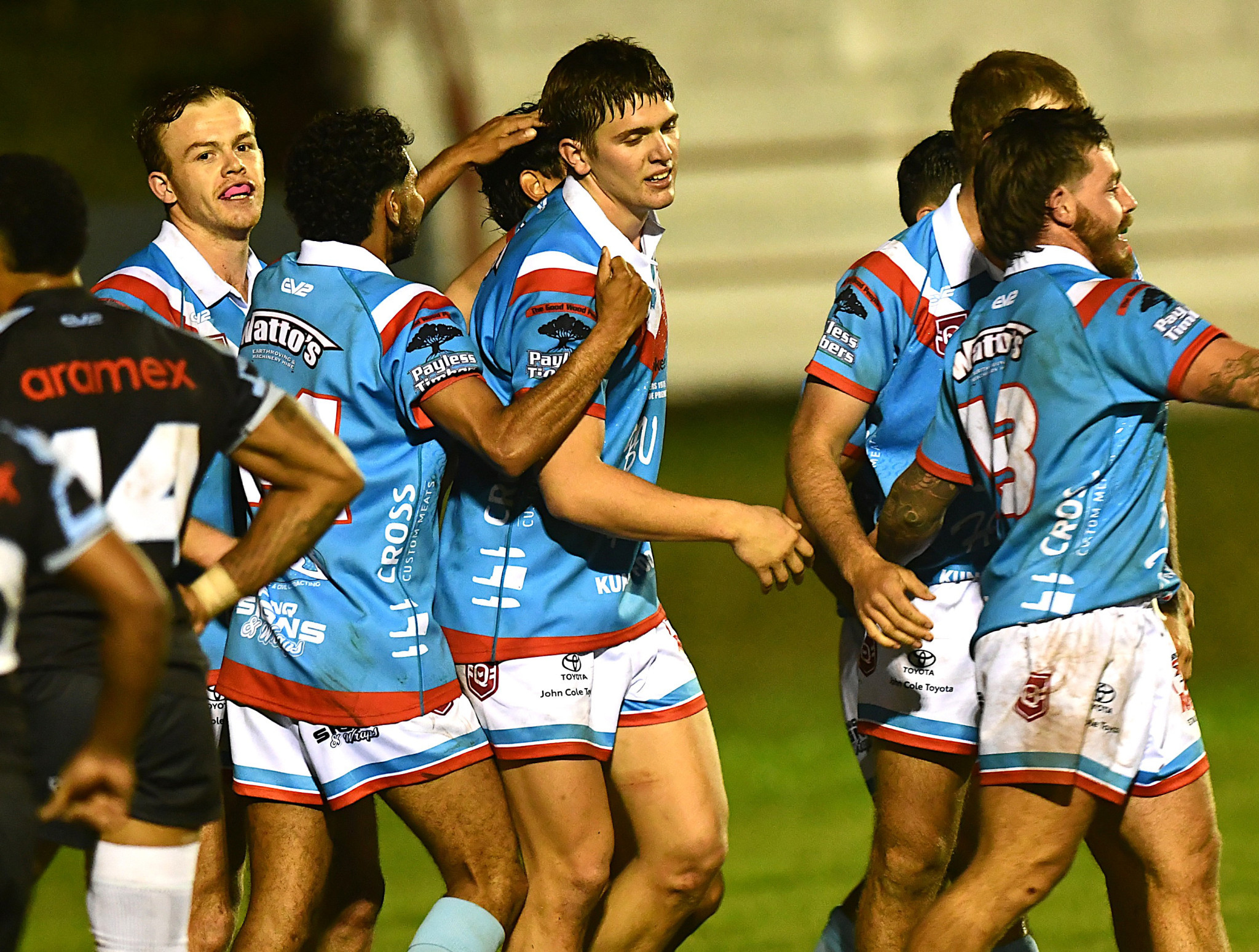 The Roosters celebrate their first try.