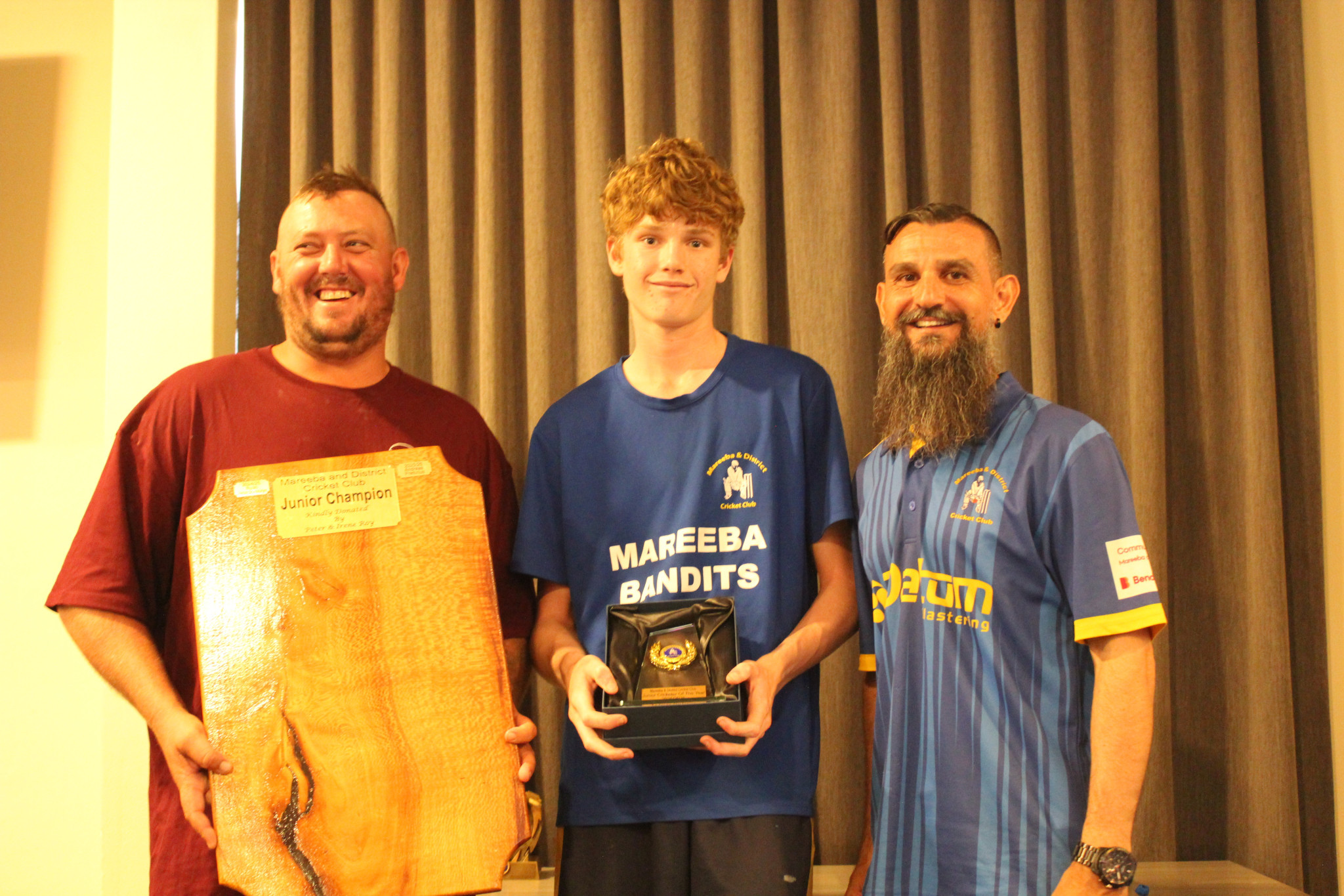 Junior Cricketer of the Year Andreas Pretorius with award presenters Adam Parnell (A&B Civil) and junior cricket vice president Remo Esposito.
