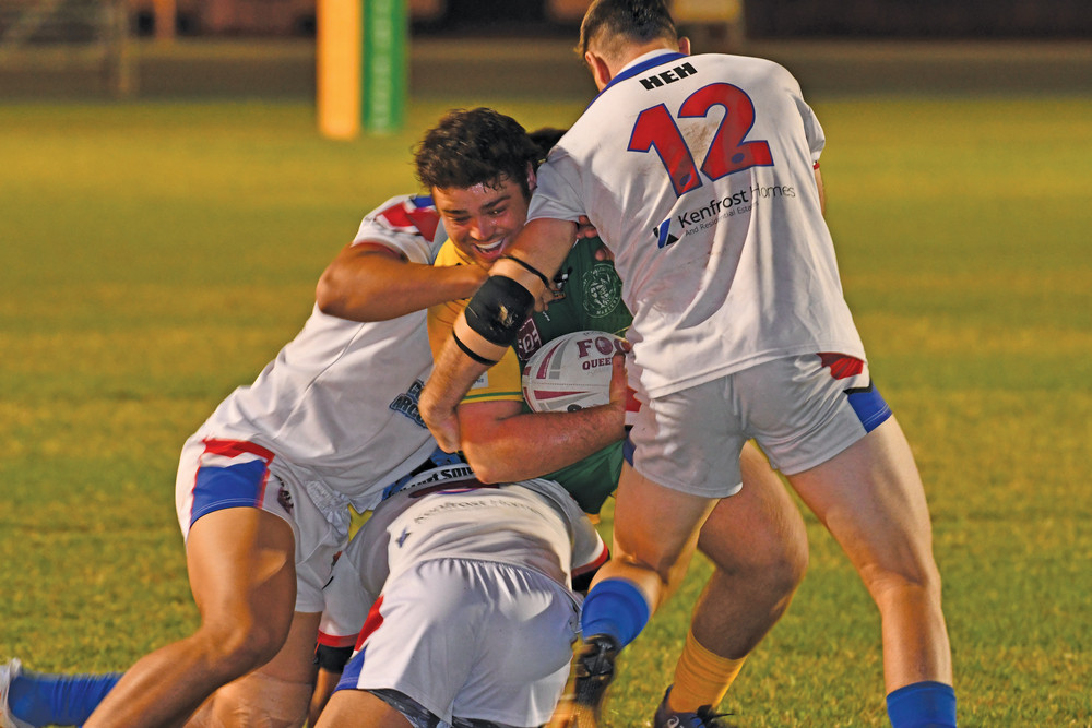 Gladiator Caleb Daley being brought down by Ivanhoe defenders on Saturday night.